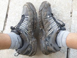 My shoes covered in mud after the uneasy walk