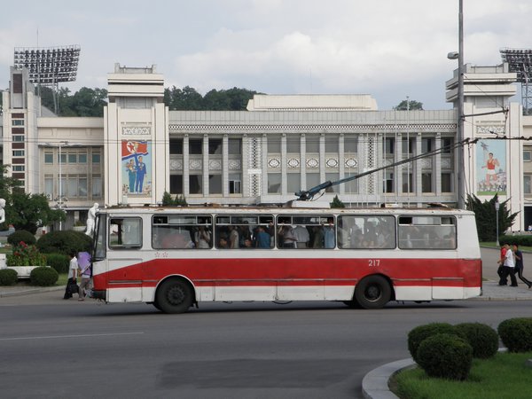 A trolley bus in front of Kim Il Sung Stadium