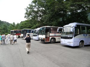 Numerous tour-buses outside the Friendship Exhibition
