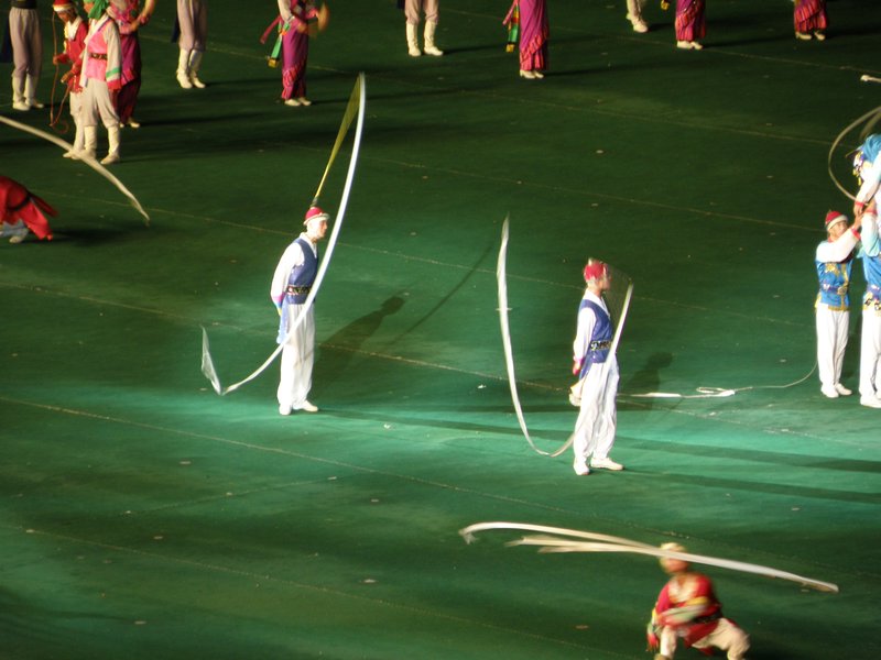 Dancers wearing hats with long ribbons