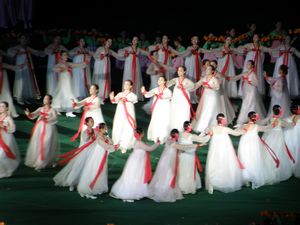 Dancers in traditional white dresses