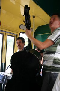 A 4 piece band entertaining on the bus