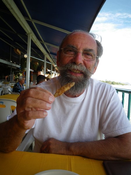 Steve tries a deep-fried whole fish - head and all
