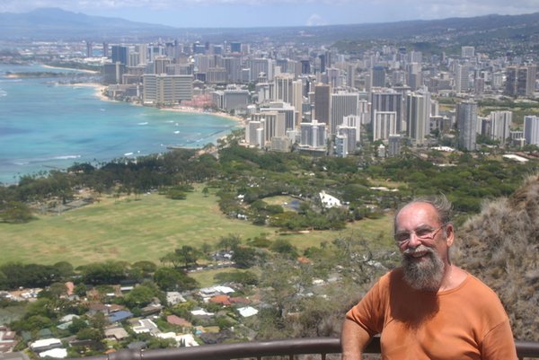 Steve at top of Diamond Head with view of Waikiki