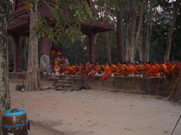 Monks at Bayon at sunset