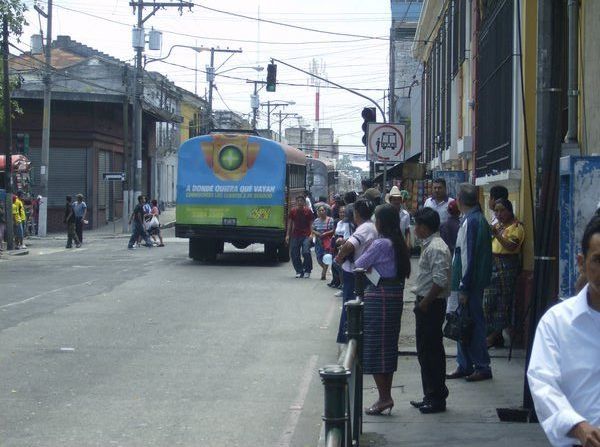 People waiting for the chicken bus