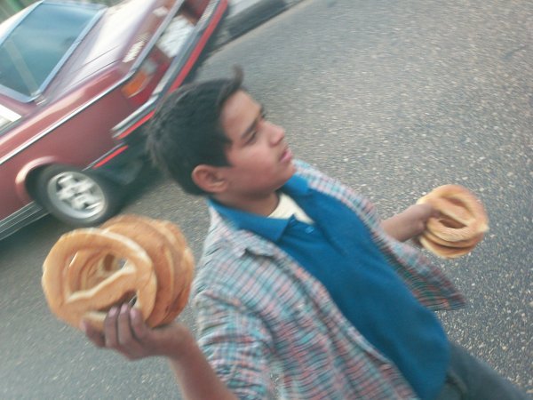 Boy selling bread on the street