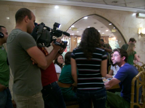 Reporter interviews American student
