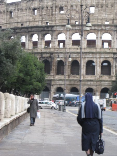 a nun by the Coliseum