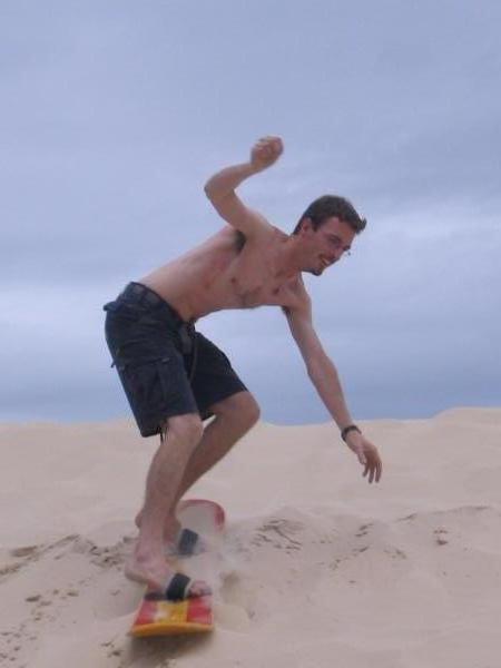 John attempting to sandboard on the dunes of Joaquina
