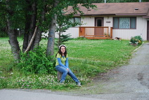 Madeline in front of their house