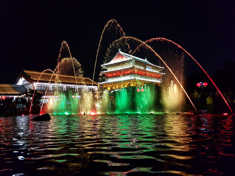 Drum Tower lit up at night with fountain displays
