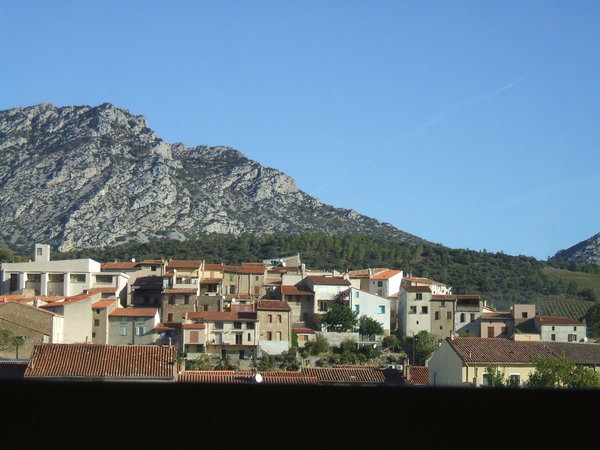 a view of a village from the train