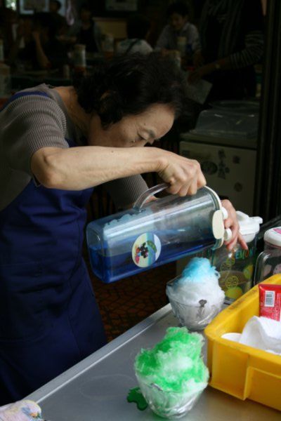 Sima snaps this lady making tasty ice shavings