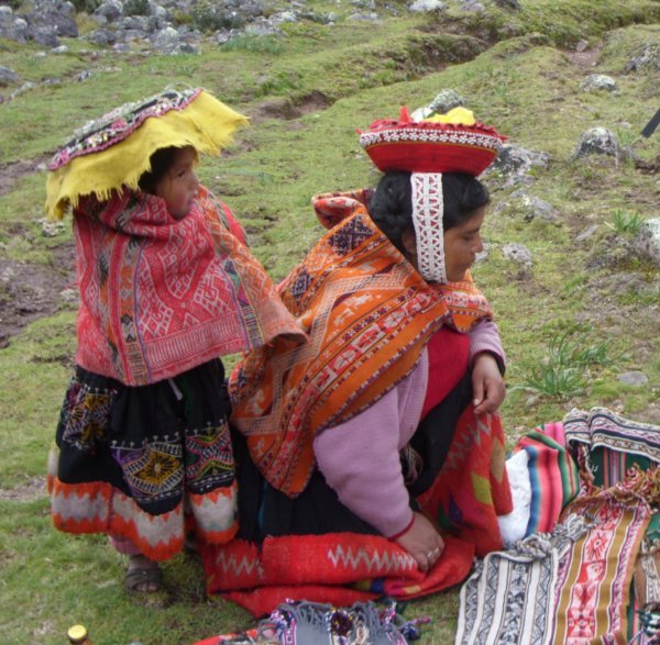 103 Traditional  Quechua lady and her daughter selling handmade textiles