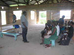 Pastor Samson  organizing the villagers for the clinic 