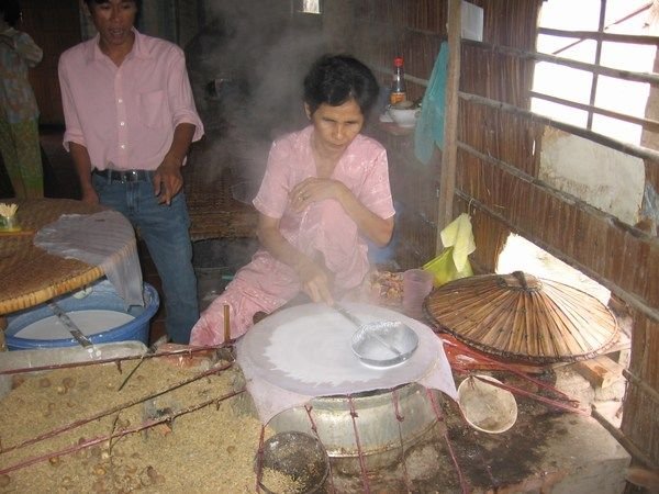 Lady making rice paper
