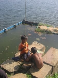 Young boys fishing by the lake