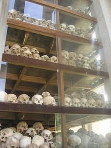 Shelves of skulls sit in the memorial stupa