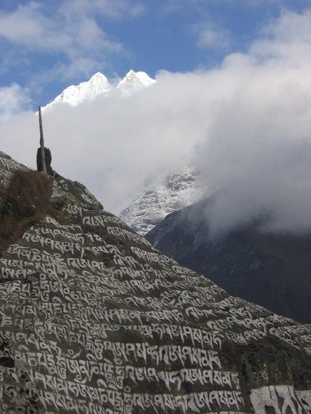 Rocks covered in Tibetan writing stand all over the Himalayans