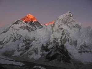 The last rays of the sun catch the summit of Mt. Everest