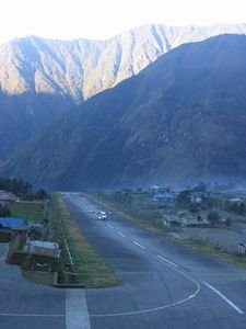 A plane lands on Lukla's short runway