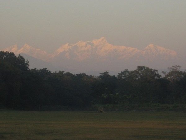The Annapurna mounatin range can be seen in the distance from the Chitwan riverbank