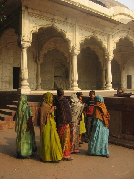 Locals huddle inside the Red Fort in Delhi