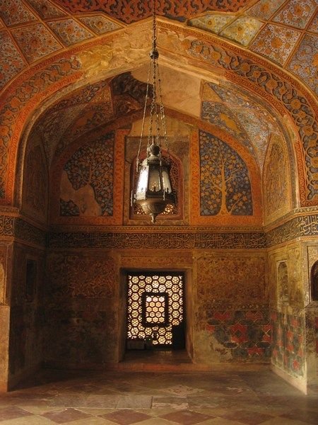 Intricate carvings and colors grace the walls of Akbar's tomb