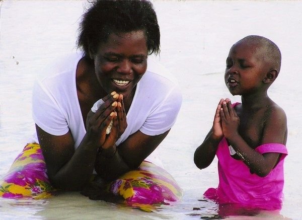 A Luo and a Kikuyu praying together in the Indian Ocean