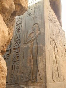 A carving of Nefertari on the back of Ramses III's statue
