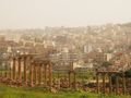 The Jerash ruins backdropped by the city