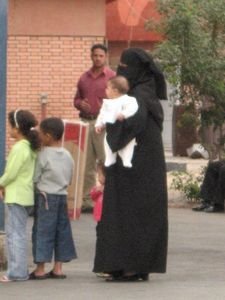 A local Muslim woman and her children