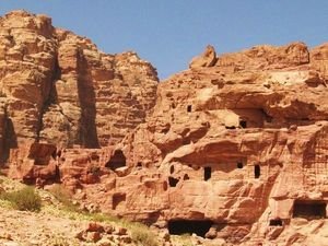 Small caves dot the cliffs of Petra