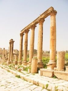 Roman pillars stand throughout the ruins of Jerash