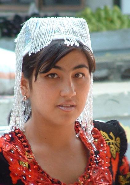 Recently married Uzbek girl with traditional hat.