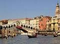 Gondola on Grand Canal beside Rialto Bridge