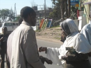 Giving alms to blind man
