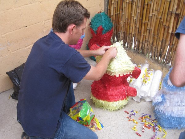 Filling the pinata with lollies