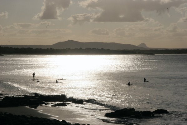 surfers at dusk