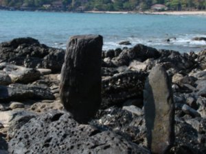 Rocks on the far side of the beach.