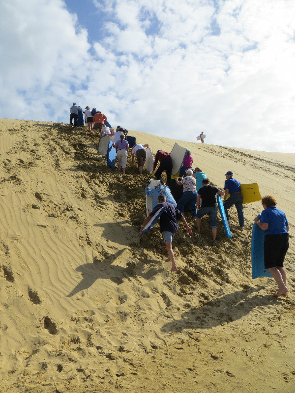 trudging up the sand dune