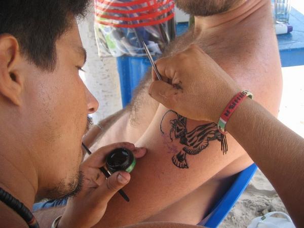 Samuel getting a Henna Tattoo
