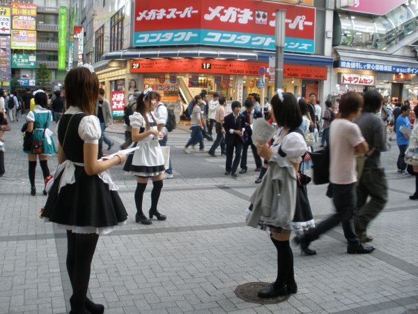 Maids outside the station
