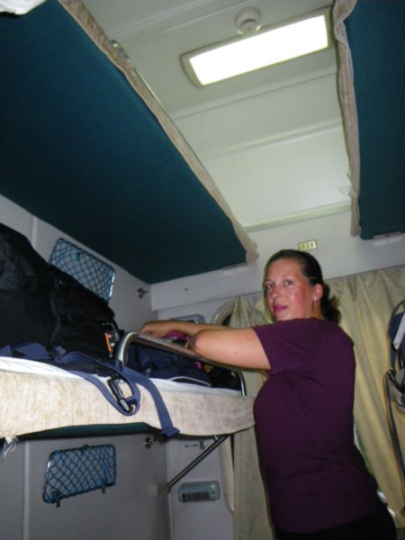 Laura selecting the middle bunk for our first night train