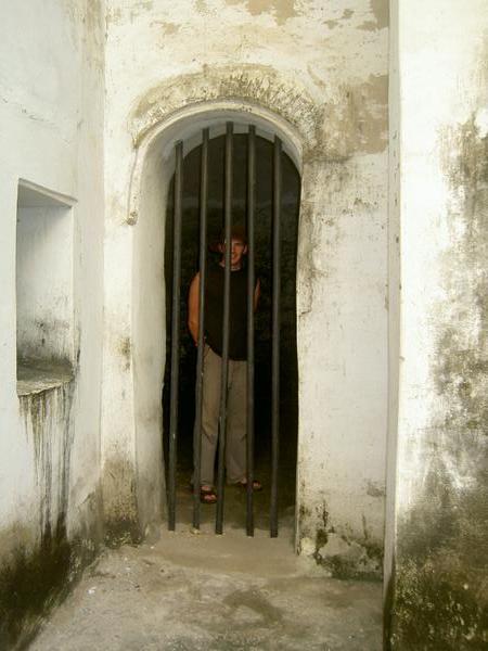 Neil behind bars, St Georges Castle, Elmina