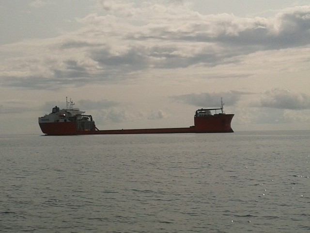 Ship anchored waiting to clear in