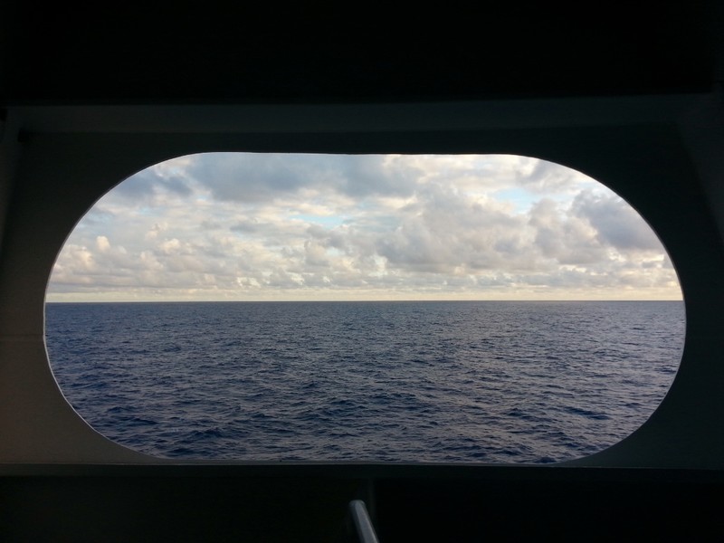looking through the porthole on deck