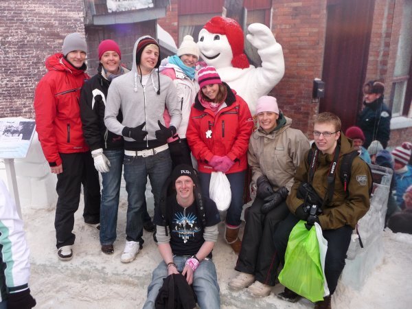 The group posing with the Carnival mascot Bonhomme