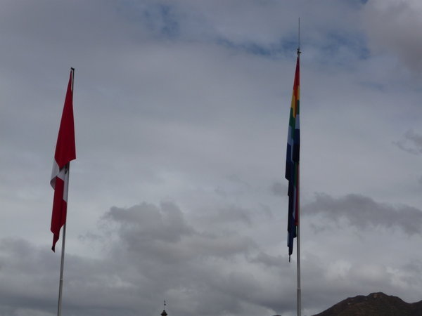 The peruvian and Incan flag flying side by side